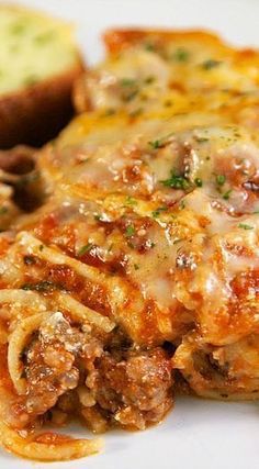 a close up of food on a plate with bread