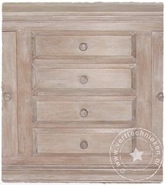 a white dresser with drawers and knobs on it