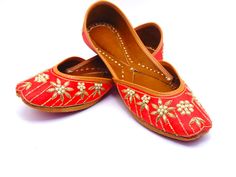 Durable, hand-stitched shoes in the ethnic Indian/Pakistani design, with a leather-padded cushion inside and a genuine leather sole. These stunning pieces feature zardozi and pearl embroidery in a clean, straightforward design on genuine leather with red raw silk base. These shoes are perfect for special occasions as well as everyday usage. Among our most beloved shoe selections for formal events like weddings. These shoes can look great on you with any type of attire. These will make you fall in love, whether you buy them for yourself or as a gift for a friend.To view more of our selection, visit our page! We ship out in a timely matter, wrapped in care for a safe secure trip to your location. Thank you for supporting our small business! Shipped from USA. Sizes available US 5,6,7,8,9,10,1 Pakistan Design, Pakistani Design, Pearl Embroidery, Sandals Flats, Raw Silk, Bridal Shoes, Hand Stitched, Flat Sandals, Womens Flats