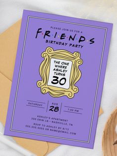 a purple birthday party card with the words friends on it and a wooden slice of pizza