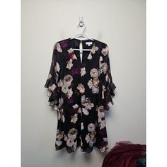 This Is A Calvin Klein Dress In Size 6 With A Floral Pattern And A V-Neckline. The Dress Has 3/4 Length Flared Sleeves And Is Made Of Chiffon Fabric. It Falls To A Midi Length And Has A Fit And Flare Or A-Line Style. The Dress Is Suitable For Various Occasions Such As Weddings, Parties, Casual, Formal, Workwear, And Business. The Dress Is Brand New With Tags And Is Lined. The Dress Has A Flower Theme. Clothes Have Been Washed Or Cleaned Calvin Klein V-neck Mini Dress For Spring, Theme Clothes, Calvin Klein Blue Dress, Grey Sheath Dress, Formal Workwear, Corporate Dress, Summer Dress Patterns, Pink Sleeveless Dress, Flower Theme