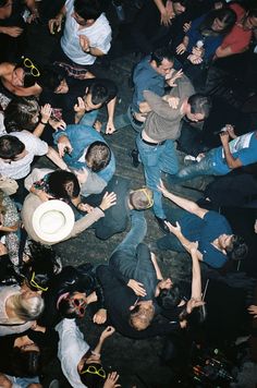 a group of people standing around each other