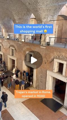 people are standing in an old building and looking at something on the wall that says, this is the world's first shopping mall