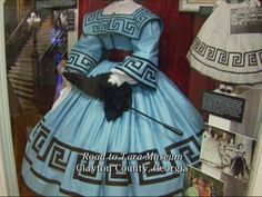 the dress is blue and white with black trims on it, along with other items