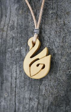 "This very unique Celtic Necklace will be made for you, or a loved one, in my studio on the West of Ireland. This beautiful Celtic Swan pendant features a piece of boxwood, recycled from musical instruments constructed by a local luthier. As a musician myself, I take enormous satisfaction in creating a necklace whose inherent wood has previously featured in a beautiful hand-made flute. Also, part of boxwood's attractiveness is its durability and ability to stand the test of time and of course th Traditional Wooden Necklace For Gift, Symbolic Carved Necklace For Gifts, Spiritual Wood Jewelry For Gifts, Spiritual Natural Wood Jewelry Gift, Artisan Wooden Jewelry As A Gift, Artisan Wood Jewelry Gift, Natural Carved Necklaces As Gift, Natural Wood Pendant Jewelry As Gift, Natural Wood Pendant Jewelry For Gifts