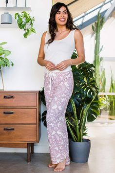 A woman standing and smiling with her hips turned to the side Bamboo Pajamas, Women Pajamas, Eco Friendly Clothing, Pajama Pant, Contrast Piping, Sleeveless Tunic, Sleepwear Robe, Womens Size Chart, Night Shirt