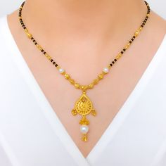 PRODUCT DETAILS Gold Purity(karat): 22k Item Weight(grams): 14.9 Item Finish: Yellow Gold Stone: Black Bead + Pearl Necklace Length: 20.5" Drop Length: 1.6" Adjustable Links: 1.6﻿" Lock Style: Hook Lock Elegant Black Temple Necklace For Festive Occasion, Black 22k Gold Jewelry For Wedding, Black 22k Gold Wedding Jewelry, Elegant Black Temple Necklace For Wedding, Black 22k Gold Necklace For Weddings, Gold Pearl Necklace With Black Round Beads, Elegant Black Temple Necklace As Gift, Elegant Black Temple Necklace Gift, Bead Pearl Necklace