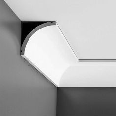 a black and white photo of a ceiling with a skylight in the corner,