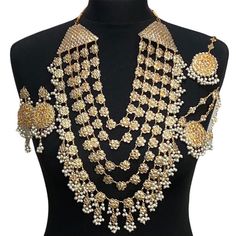 Pakistani bridal set. Includes- Mala Jhumar Tikka Earrings Heavy Pearl Necklace For Weddings And Festivals, Gold Kundan Bridal Accessories For Reception, Gold Temple Jewelry Bridal Accessories, Festive Bridal Necklace With Stone Work For Marriage, Gold Bridal Sets For Reception And Diwali, Bollywood Style Chandbali Kundan Necklace For Marriage, Kundan Bridal Necklace For Diwali Marriage, Kundan Bridal Necklace For Marriage During Diwali, Gold Temple Jewelry Bridal Accessories With Stone Work