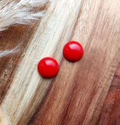 Rockabilly Cherry Red Stud Earrings Understated and stunning, these 17mm earrings will be a staple accessory for any Rockabilly gals jewellery box! They are hand cast in cherry red resin and finished off with silver earring posts. The earrings posts are silver tone brass and have a butterfly fastening. They are lead and nickel free. To see more of my pin up and vintage style earrings please click on the link below www.etsy.com/uk/shop/RosieMays?section_id=39011078 Thank you for visiting Red Stud Earrings, Red Earrings Stud, Red Studs, Vintage Style Earrings, Earring Posts, Red Earrings, Resin Earrings, Hand Cast, 1950s Fashion