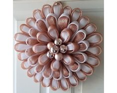 a close up of a door with a flower decoration on it's front door