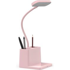 a pink desk lamp with pens and pencils in it on a white surface next to a pen holder