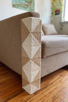 a couch sitting on top of a hard wood floor