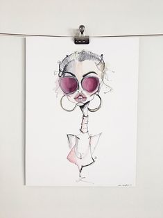 a drawing of a woman wearing sunglasses hanging on a clothes line