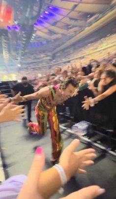 a man is dancing in front of an audience