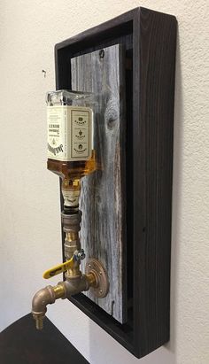 a wooden shelf with a water faucet attached to it