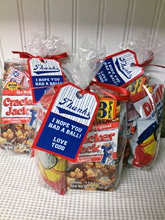 several bags of snacks sitting on top of a table