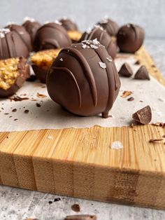 some chocolates are sitting on a cutting board