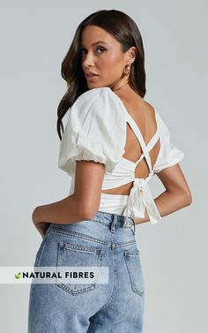 Get ready to turn heads at your next party with the Liliosa Top! This stunning square neck top is perfect for fashion-forward babes who love making a statement. With its puff sleeves and tie back detail, this white cotton top will add a touch of elegance and style to any outfit. Crafted from high-quality cotton, it's both comfortable and breathable for all-day wear. Whether you're going for a casual or dressy look, this Liliosa Top is here to elevate your standard of style. Pair it with your fav White Cotton Top, Square Neck Top, Versatile Outfits, Puff Sleeve Top, Fabric Squares, Cotton Top, Tie Backs, Fashion Tops, Tie Back