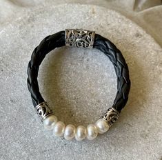 Beautiful Braided Black Leather Sterling Silver Natural Pearl Vintage Bracelet See pictures next to ruler for scale See link below for matching necklace https://www.etsy.com/listing/981075566/beautiful-braided-black-leather-sterling?ref=shop_home_active_1&frs=1 Handmade Elegant Leather Bracelet, Elegant Handmade Leather Bracelet, Elegant Handmade Black Leather Bracelet, Pearl Vintage, Usa Jewelry, Beautiful Braids, Vintage Bracelet, Handcrafted Necklace, Natural Pearl