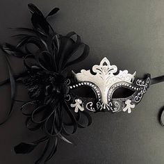 Simplistic for woman with a black floral- destined to pop out at any event, wedding etc The black silver women mask is veil decoration with feather and blossoming branches. This masquerade mask is great for any occasion. Luxury Black Mask For Cosplay, Black And White Masquerade Mask, Black Masquerade Mask Women, Masquerade Mask Aesthetic, Mask Ball Party, Veil Mask, Black And White Mask, Fancy Mask, White Masquerade Mask