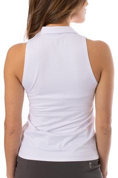 the back of a woman's white tank top, with her hands on her hips