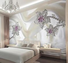 the bedroom is decorated in white and silver