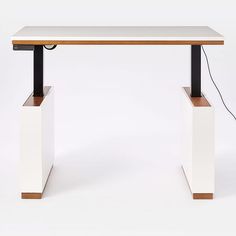 a white table with two black legs and a wooden top on an isolated white background