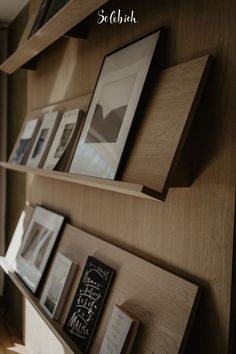 the shelves are filled with books and pictures