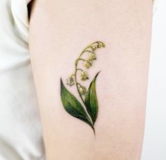 lily of the valley tattoo on the right thigh