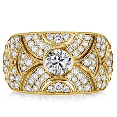 a yellow gold ring with diamonds on the sides and a center stone in the middle