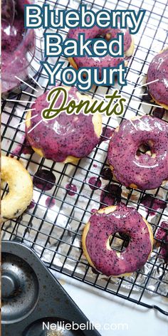 blueberry baked yogurt doughnuts on a cooling rack with the words, blueberry baked yogurt donuts