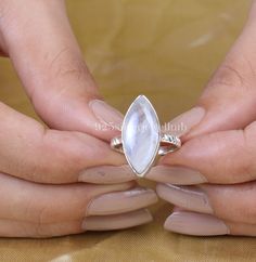 Natural Rainbow Moonstone Ring, 925 Sterling Silver Ring, Marquise Gemstone Ring, June Birthstone Ring, Handmade Jewellery, Ring For Women Gemstone Name - Rainbow Moonstone  Stone Quality - AAA Ring Weight - 3.86 gm Ring Length - 2.2 cm Ring Width - 1.1 cm Stone Shape - As shown in the picture Ring Size - All Ring Size Available You'll get the exact product as shown in the pictures We serve complete 925 sterling silver Jewelry and genuine properties of the stone. The products are dispatched from White Marquise Gemstone Jewelry, White Sterling Silver Gemstone Ring, Marquise White Sterling Silver Ring, Handmade Moonstone Rings In Fine Jewelry Style, Marquise Sterling Silver Ring In White, Handmade Fine Jewelry Moonstone Rings, Handmade Moonstone Rings, Fine Jewelry, Moonstone Marquise Jewelry As A Gift, Moonstone Marquise Jewelry For Gift