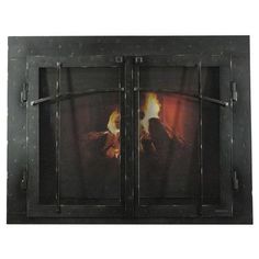 a fire burning in a fireplace next to a wall mounted heater on a metal frame