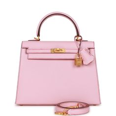 This Special Order (HSS) Kelly, is in Rose Sakura chevre leather with brushed gold hardware and has contrast stitching, two straps with front toggle closure, clochette with lock and two keys, single rolled handle and removable shoulder strap.The interior is lined with Rose Sakura chevre leather and has one zip pocket with an Hermes engraved pull and one open pocket on the opposite side. Collection: UOrigin: FranceCondition: New and never (plastic on hardware) Accompanied by: Hermes box, Hermes d Rose Sakura Hermes, Hermes Special Order, Kelly Sellier, Brushed Gold Hardware, Hermes Box, Birkin 25, Wallet Case, Gold Hardware, Rolex