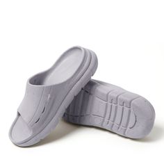 Comfort with a conscience. A perfect mix of lightweight and supportive; these slides were also made using recycled materials, so Earth can get in on the comfort, too. Comfortable Non-slip Gray Slides, Gray Non-slip Comfortable Slides, Comfortable Gray Slide Sandals, Gray Non-slip Slides For Summer, Non-slip Gray Slides For Summer, Lightweight And Comfortable Slides With Textured Footbed, Lightweight Textured Footbed Slip-on Slides, Gray Open Toe Slides For The Beach, Lightweight Textured Slip-on Slides