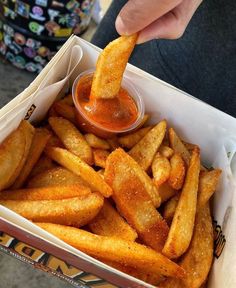 french fries with dipping sauce in a box