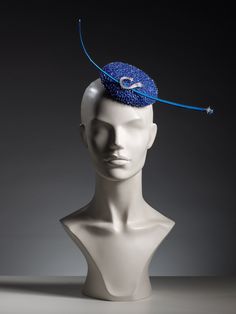 "You are looking at a unique mini round pill box in royal blue made using luxury beaded fabric and adorned with star themed accessories.  This headpiece although very simple in style but can definitely turn heads when in public. It hats a small star on the end of an ostrich quilt, which catches the light in such an amazing way. It also has a comet-like brooch in the middle but since this is a vintage find, it will be replaced to a similar style brooch after the original design will be sold. Plea Blue Adjustable Headpiece With Pinched Crown, Blue Structured Crown Headpiece For Evening, Adjustable Blue Headpiece With Pinched Crown, Handmade Blue Party Hat, Blue Party Headpiece With Pinched Crown, Elegant Handmade Blue Hats, Elegant Round Crown Headpiece For Gifts, Elegant Round Crown Headpiece As Gift, Adjustable Blue Mini Hats For Events