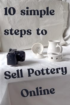 a table topped with white pottery next to a sign that says 10 simple steps to sell pottery online