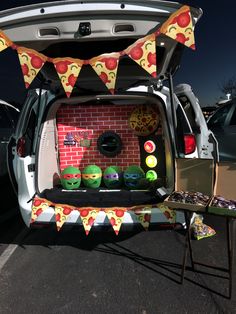 the back of a car with pizza themed decorations