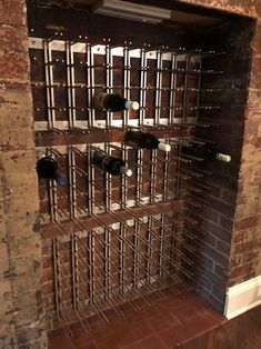 the wine rack is made out of metal bars