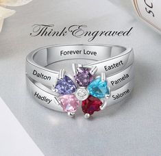 Personalized Mother's Ring 5 Birthstones 5 Engraved Names Flower Design This beautiful design makes a great mother's ring or grandmother's ring. This ring is made of .925 sterling silver. You can choose 5 engraved names and 5 birthstones. Enter like this, please- Birthstone 1- Name 1- Birthstone 2- Name 2- Birthstone 3- Name 3- Birthstone 4- Name 4- Birthstone 5- Name 5- We hand-make this piece once the order is placed.  This takes 3-5 business days during the normal time of year but can take up Personalized Silver Flower Ring For Anniversary, Flower-shaped Ring For Mother's Day Anniversary, Flower Ring For Mother's Day Anniversary, Flower Shaped Ring For Mother's Day Anniversary, Flower Shaped Ring For Anniversary And Mother's Day, Flower Shaped Anniversary Ring For Mother's Day, Anniversary Flower Ring For Mother's Day, Round Flower Ring For Mother's Day Anniversary, Round Flower Ring For Anniversary And Mother's Day