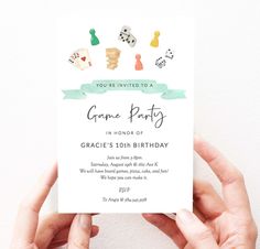 a person holding up a card with some pins on it that reads, you're invited to a game party in none of grace's 10th birthday