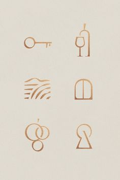 six different types of symbols are shown in gold on a white paper background, including the letter g