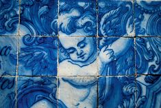 blue and white tiles with an image of a woman's face