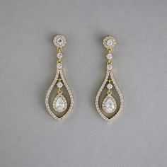 Glistening teardrop-shaped CZ earrings, crafted in layers of timeless beauty, will add a touch of subtle elegance to your bridal look. These earrings are rhodium or gold plated, hypoallergenic, lead, nickel, and cadmium free, and made with AAA CZ stones. They measure about 2 inches long and 5/8 inches wide and have post pierced backs. Bride Hair Down, Teardrop Bridal Earrings, Fav Products, Teardrop Jewelry, Weaving Ideas, Gold Earrings Wedding, Eye Makeup Designs, Subtle Elegance, Pinterest Ideas