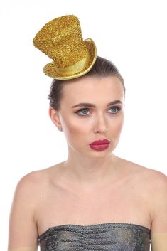 PRICES MAY VARY. Shiny tinsel mini hat perfect for Mardi Gras and St. Patrick's Day Ideal as party favors, photo booth props, or fun holiday accessories! Features elastic band to ensure comfortable all-day wear Measures 6" L x 4.5" W x 4" H It fits on a portion of the head - it is not full head size Celebrate the holidays in style with this fun mini top hat! It comes in five colors (Green, Gold, Purple, Silver, and Red), and is perfect for Mardi Gras, St. Patrick's Day, and birthdays! Novelty Hats For Carnival Costume Party, Novelty Hats For Costume Party And Carnival, Adjustable Novelty Hats For Carnival, Adjustable Novelty Hat For Carnival, Novelty Adjustable Hat For Carnival, Novelty Party Hat Supplies, Whimsical Costume Hats For Carnival Party, Whimsical Costume Hats And Headpieces For Carnival Party, Fun Party Hats For Carnival