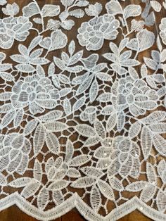 white lace with flowers and leaves on it