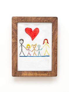 a wooden frame with a drawing of people holding hands and a red heart