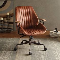 an office chair sitting on top of a wooden floor next to a table and lamp